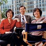 Jenny Kho, Johnson Kho, and Helen Kho in business attire
